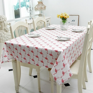 Detail of pink flamingo print on white linen-blend tablecloth for home dining decor