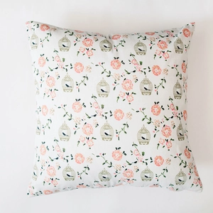 Detail of Nordic plaid pillowcase featuring floral patterns and vintage birdcage designs