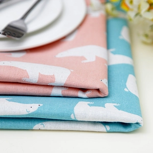 Cotton linen tablecloth featuring polar bear prints in sky blue and pink orange tones