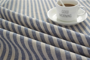 Detail of blue and white striped cotton-linen fabric with woven texture and morning vibe