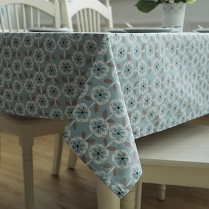 Detail of heavy cotton tablecloth with blue base and brown floral geometric pattern