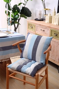 Detail of blue and white striped waterproof tablecloth featuring elegant white tassel edges