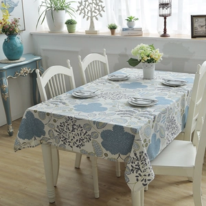 Detail of floral thick canvas tablecloth with Nordic leaf print on modern dining table