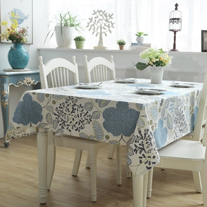 Detailed texture of thick cotton canvas tablecloth featuring blue leaf and flower prints