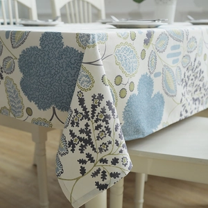 Detail of leaf and floral pattern on thick cotton canvas tablecloth for modern dining decor