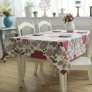 Close-up of thick cotton canvas tablecloth with red and blue leaf floral patterns