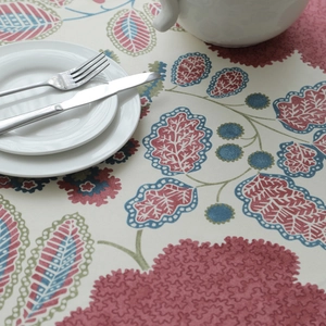 Close-up detail of heavy cotton canvas tablecloth with vintage floral and leaf patterns