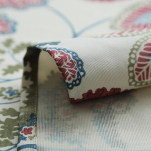 Detail view of thickened cotton canvas tablecloth with floral and paisley leaf patterns