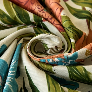 Macro shot of thick cotton canvas fabric with tropical monstera leaf print texture