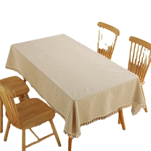 Minimalist Japanese style striped tablecloth in beige and white with elegant fringe trim
