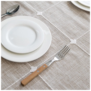 Minimalist beige embroidered plaid tablecloth with fringe edges and linen texture