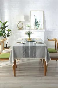 Detailed close-up of Nordic striped tablecloth with jacquard patterns and lace edges