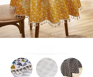 Macro detail of Nordic table cloth featuring geometric patterns and fringe tassels