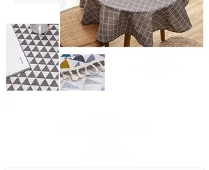 Detailed view of Nordic cotton-linen tablecloth with geometric patterns and fringe