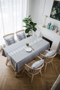 Detailed texture of waterproof faux linen table runner with geometric blue pattern