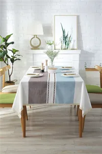 Detail of Nordic jacquard tablecloth with tricolor stitching and delicate lace border