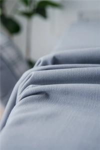 Detailed macro view of light blue faux linen fabric texture with waterproof weave