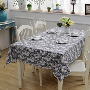 Detailed texture of thick cotton canvas tablecloth with blue floral fan patterns