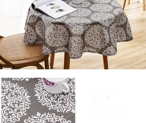 Detailed macro view of the grey cotton linen tablecloth with white mandala print and tassels
