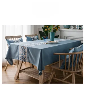 Detail of blue faux linen tablecloth featuring a unique stone pattern mosaic table runner
