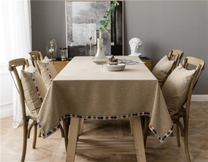 Close-up of minimalist polyester-cotton tablecloth with colorful bohemian circle lace trim