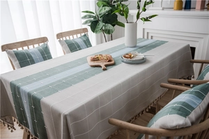 Close-up of Nordic waterproof checkered table runner with elegant cotton linen tassels