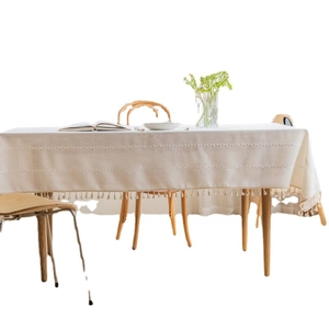 Rectangle cream linen tablecloth with boho tassels and geometric woven texture