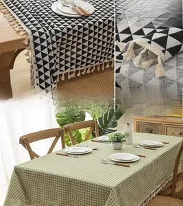 Close-up of geometric triangle and green gingham tablecloths with elegant fringe tassels
