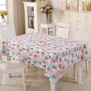 Detail of Nordic geometric pattern tablecloth with pink and blue fabric triangles