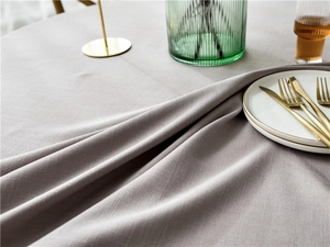 Close-up of grey waterproof linen tablecloth with elegant drape and clear texture
