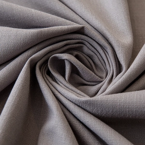 Macro texture of taupe linen tablecloth fabric with high-density weave detail