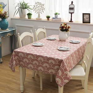 Detail of red and white floral cotton canvas tablecloth with vintage fan-shaped patterns