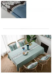 Detailed texture of green waterproof faux linen tablecloth with floral table runner