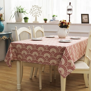 Detail of red floral cotton canvas tablecloth with thick texture and clean hem edges