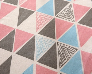 Close-up of modern striped geometric pattern on textured cotton linen tablecloth