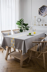 Close-up of waterproof polyester linen-look tablecloth with yellow diamond pattern