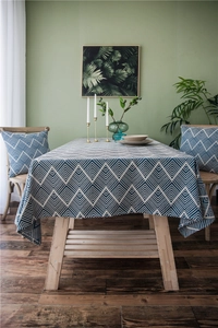 Close-up of deep blue and white herringbone jacquard pattern on high-quality tablecloth