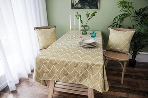 Close-up of yellow and green geometric jacquard pattern on a modern waterproof tablecloth
