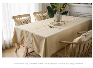 Detail of waterproof polyester linen table runner with modern stone art texture and padding