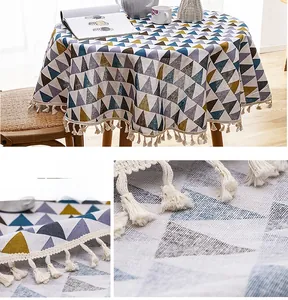 Detailed view of geometric pattern and cotton tassel fringe on round tablecloth