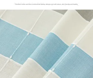 Close-up of blue and white checkered cotton linen fabric with intricate embroidery details