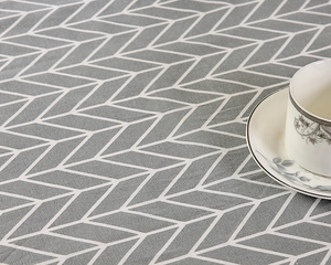 Makro-Detail des geometrischen 3D-Stoffmusters mit nordischer grau-weißer Gitterstruktur