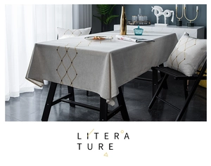 Detail of grey geometric embroidery and beadwork on waterproof modern tablecloth