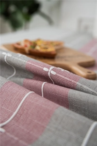 Close-up of waterproof lattice table runner fabric with textured weave and fringe