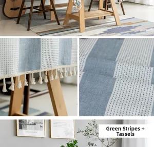 Detail of teal striped faux linen tablecloth featuring elegant cream fringe tassels
