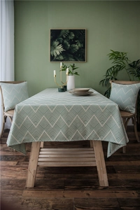 Close-up of light green chevron waterproof tablecloth with high-quality stitched edges
