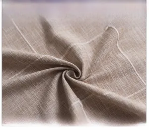 Macro detail of Nordic linen tablecloth featuring white stripes and textured jacquard weave