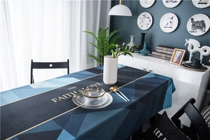 Detail of luxury velvet tablecloth with geometric prints and gold The Faith and Love text