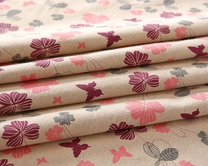 Detailed macro view of striped cotton linen fabric with butterfly and clover print