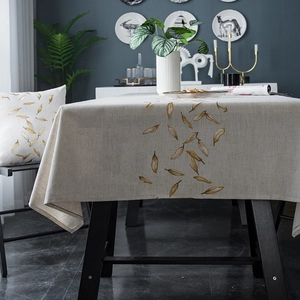 Detail of waterproof geometric tablecloth and matching cushion in modern minimalist style